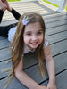 little girl wearing a lavender glitter crown shaker no slip hair clip