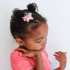 little girl wearing a star glitter shaker no slip hair clip
